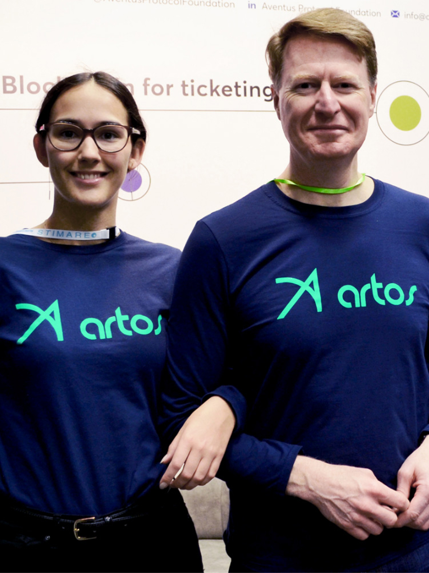 Artos t-shirts worn by happy staff members