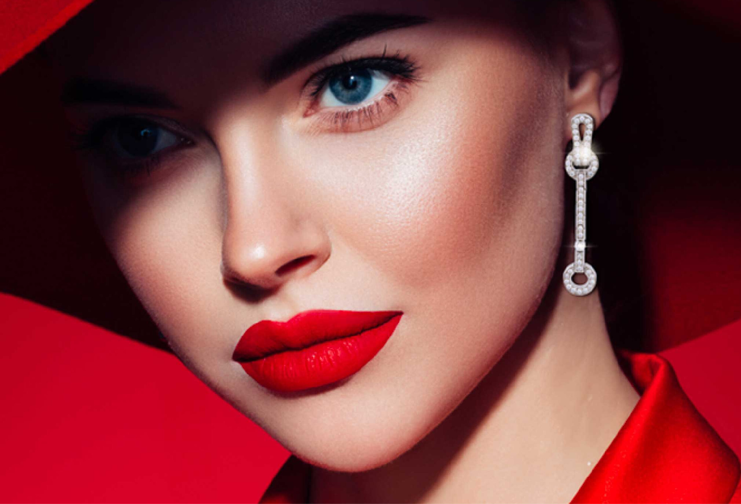 Astrea London Earring model in a red hat