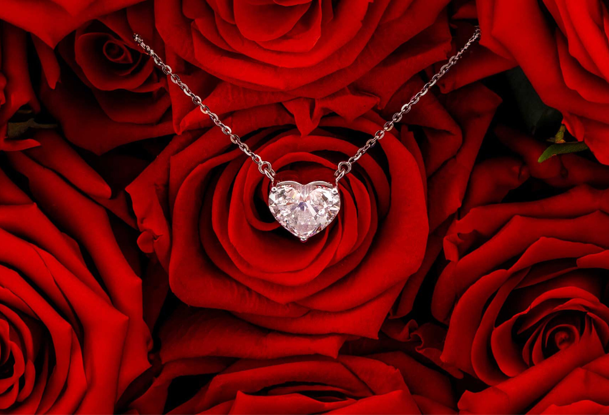 Astrea London necklace on a bed of red roses