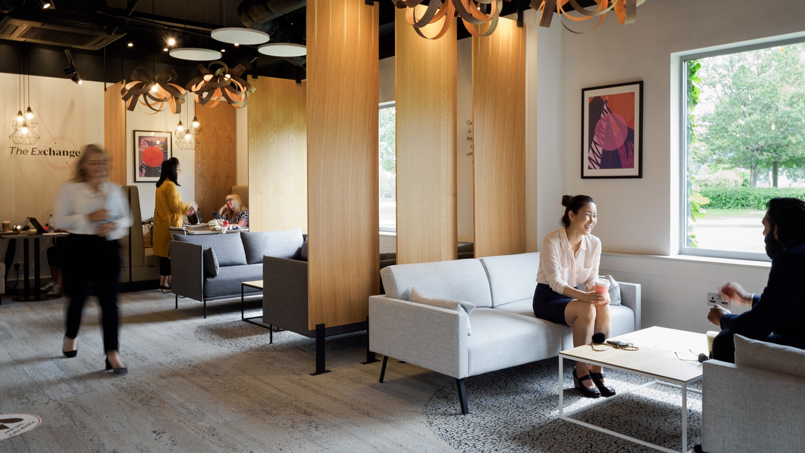 Happy employees in the Exchange Cafe, Winnersh Triangle, part of Frasers Property UK.