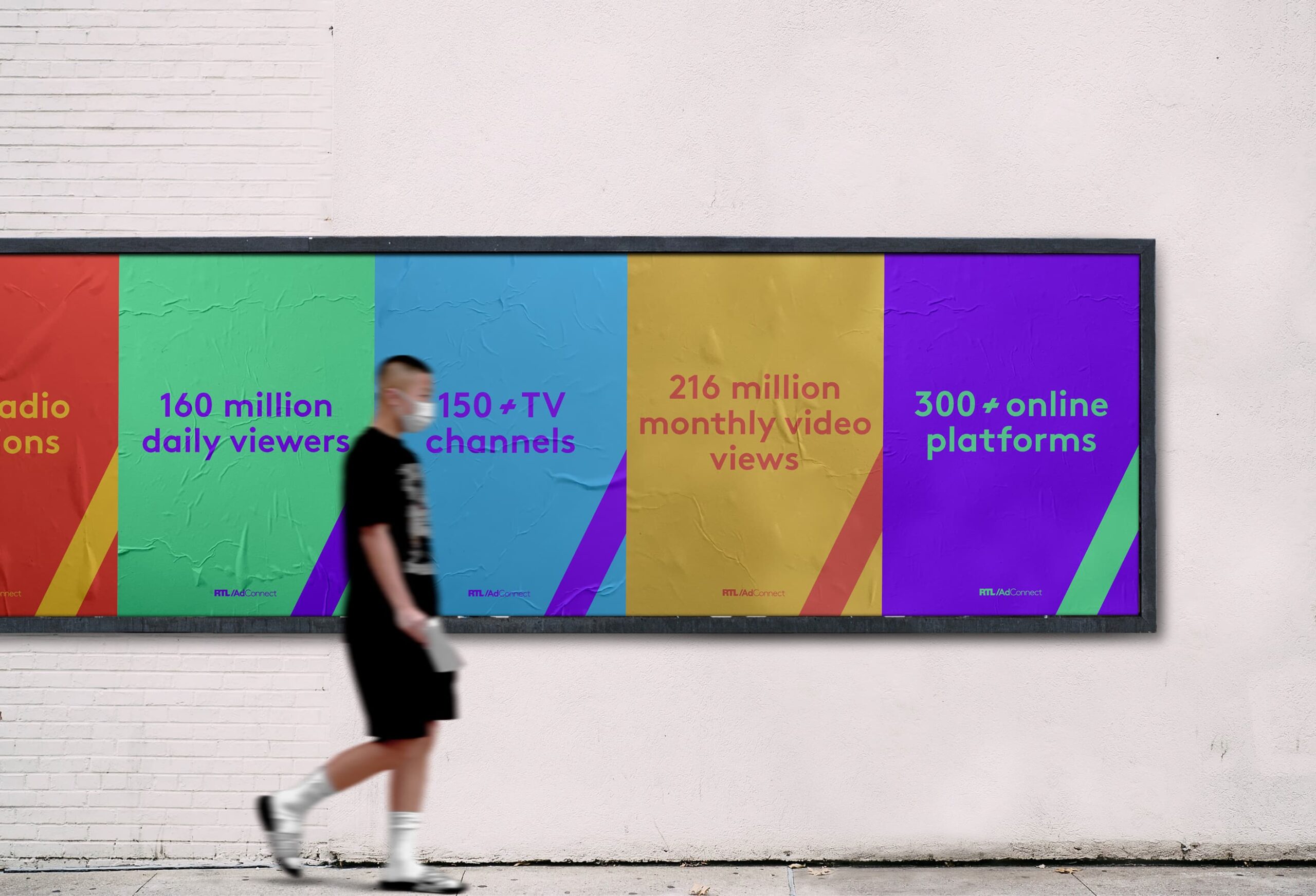 wall ad on the wall, person walking