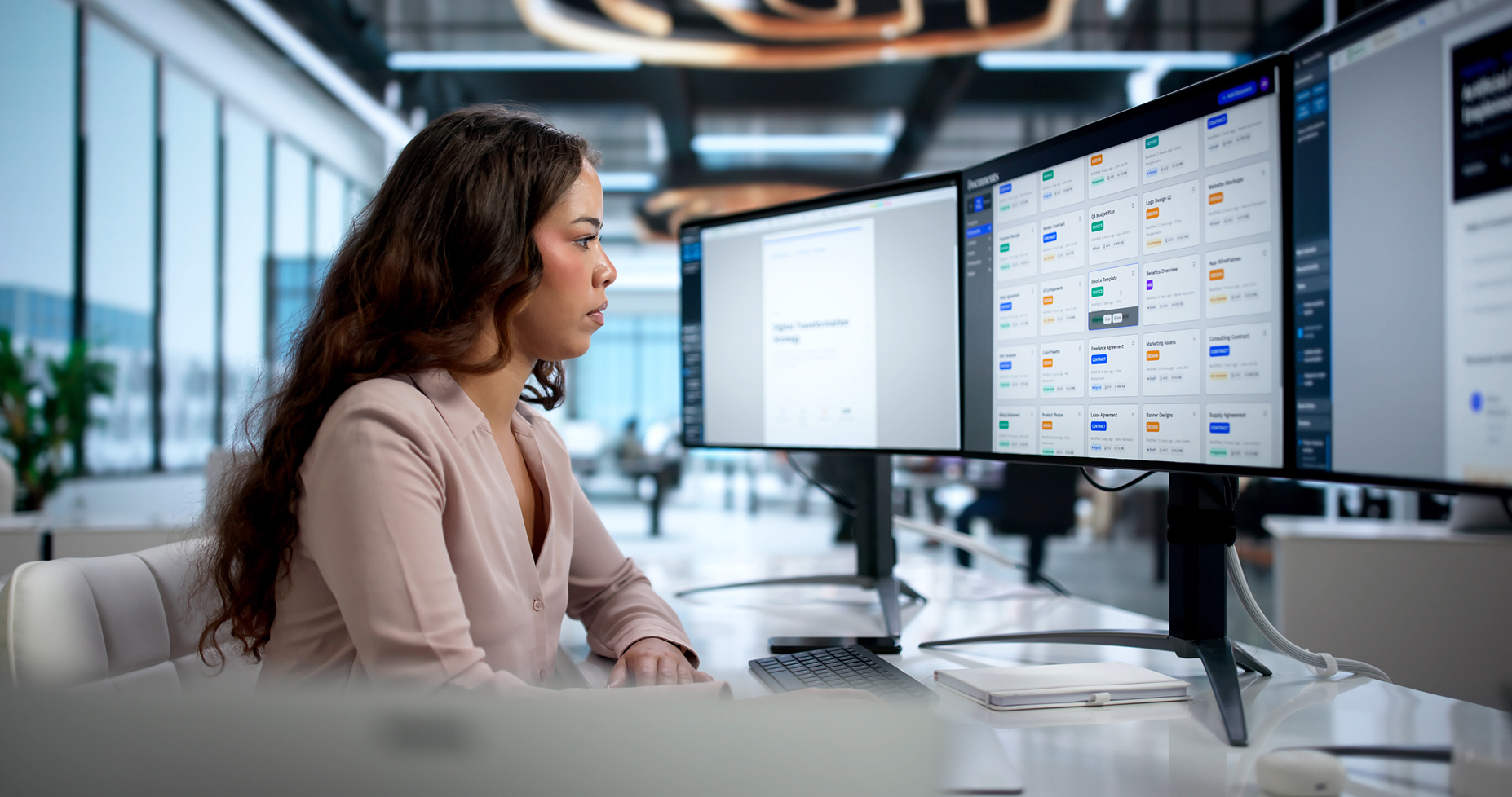Employee at a desk looking through a corporate intranet